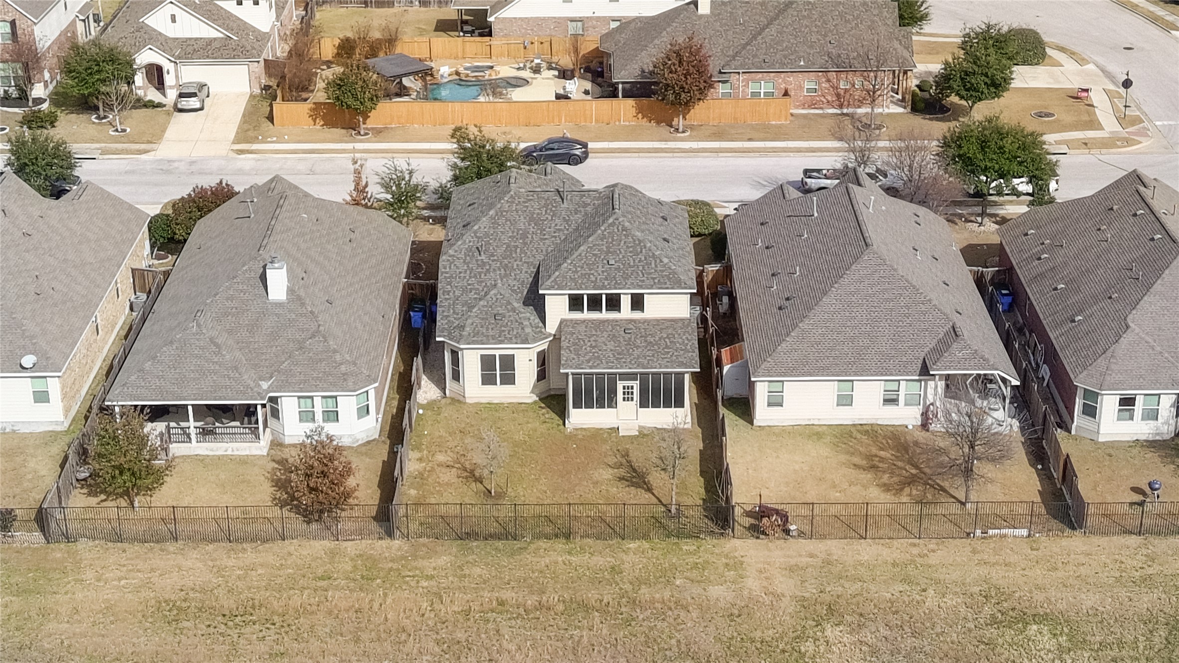 3413 Grail Hollows Road Pflugerville, TX 78660 - Photo 36 of 36 an aerial view of residential houses with outdoor space and parking