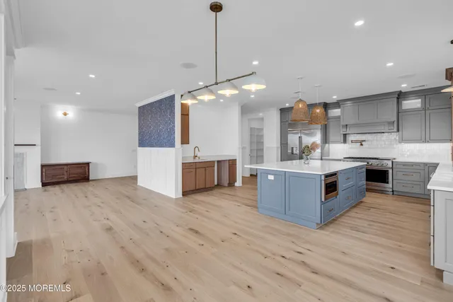 a bathroom with a toilet sink and shower