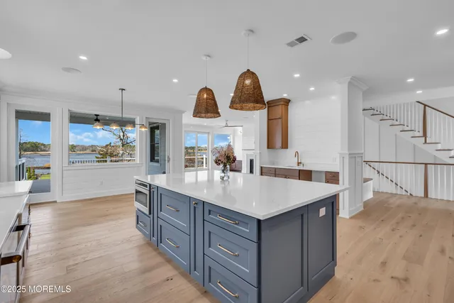 a view of a livingroom with a fireplace and window