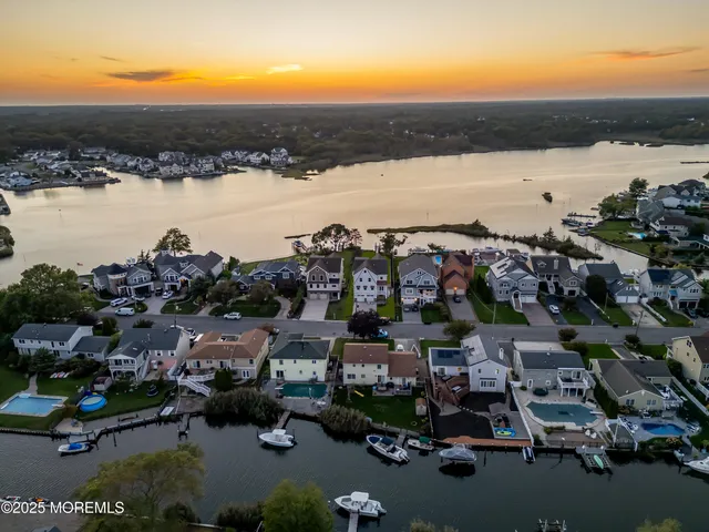 a view of an entryway with wooden floor and door