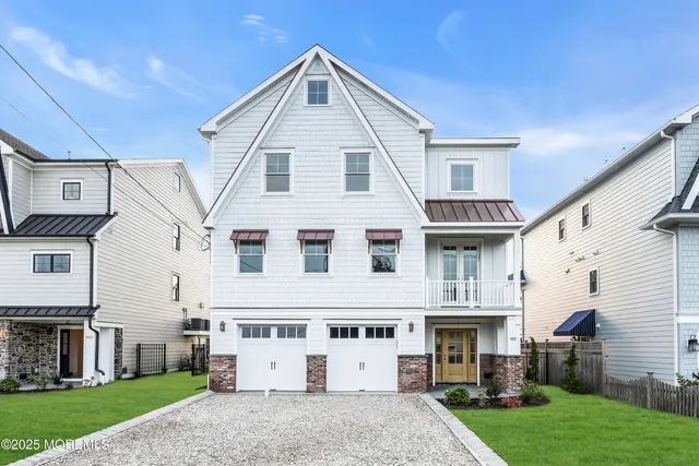 a view of a big room with wooden floor and a kitchen