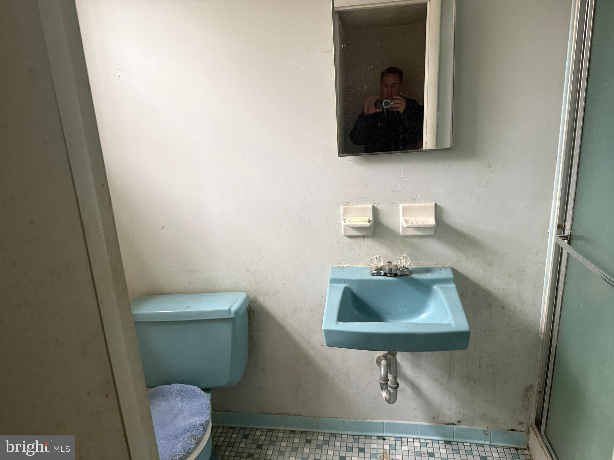 9822 Clanford Road Randallstown, MD 21133 - Photo 12 of 15 a bathroom with a toilet a sink and mirror