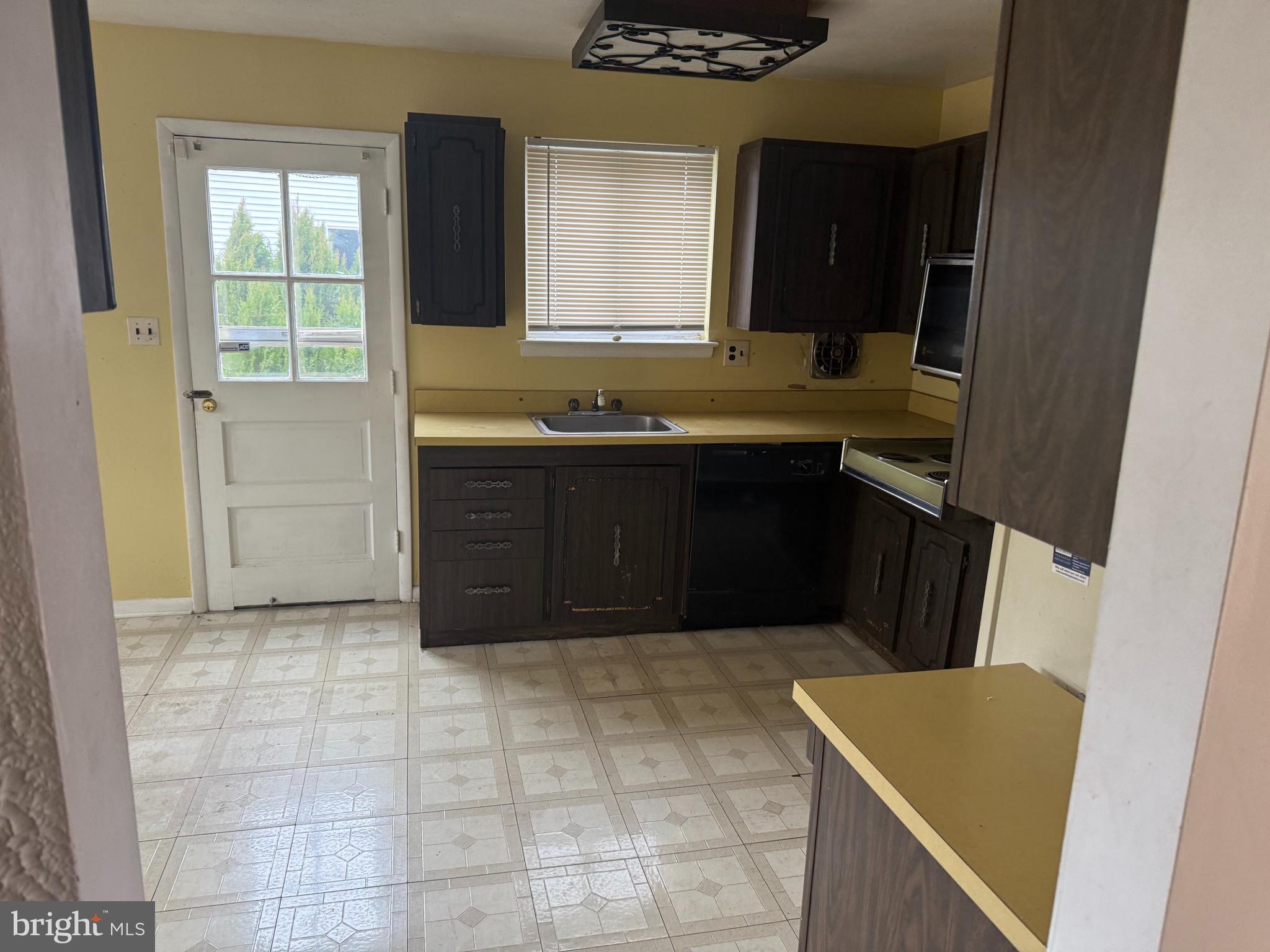 9822 Clanford Road Randallstown, MD 21133 - Photo 3 of 15 a bathroom with a sink and a mirror