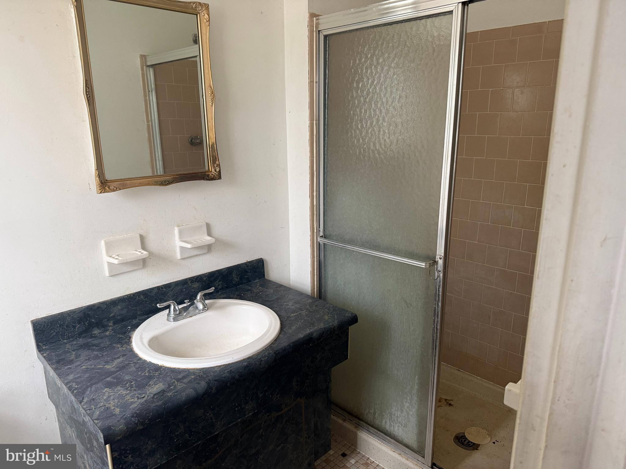9822 Clanford Road Randallstown, MD 21133 - Photo 7 of 15 a bathroom with a sink and a mirror