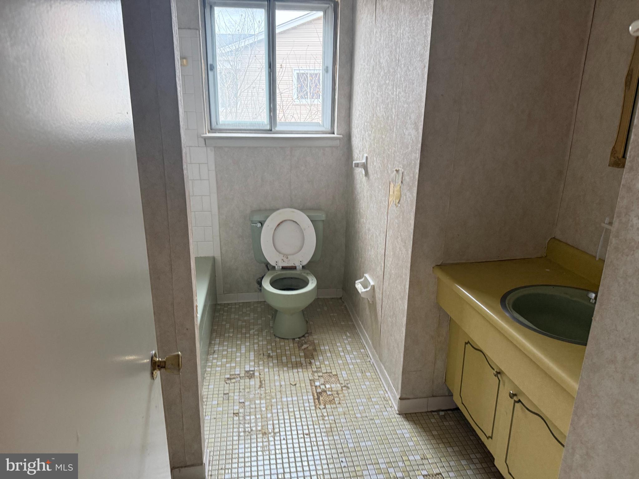 9822 Clanford Road Randallstown, MD 21133 - Photo 8 of 15 a bathroom with a granite countertop sink and a toilet