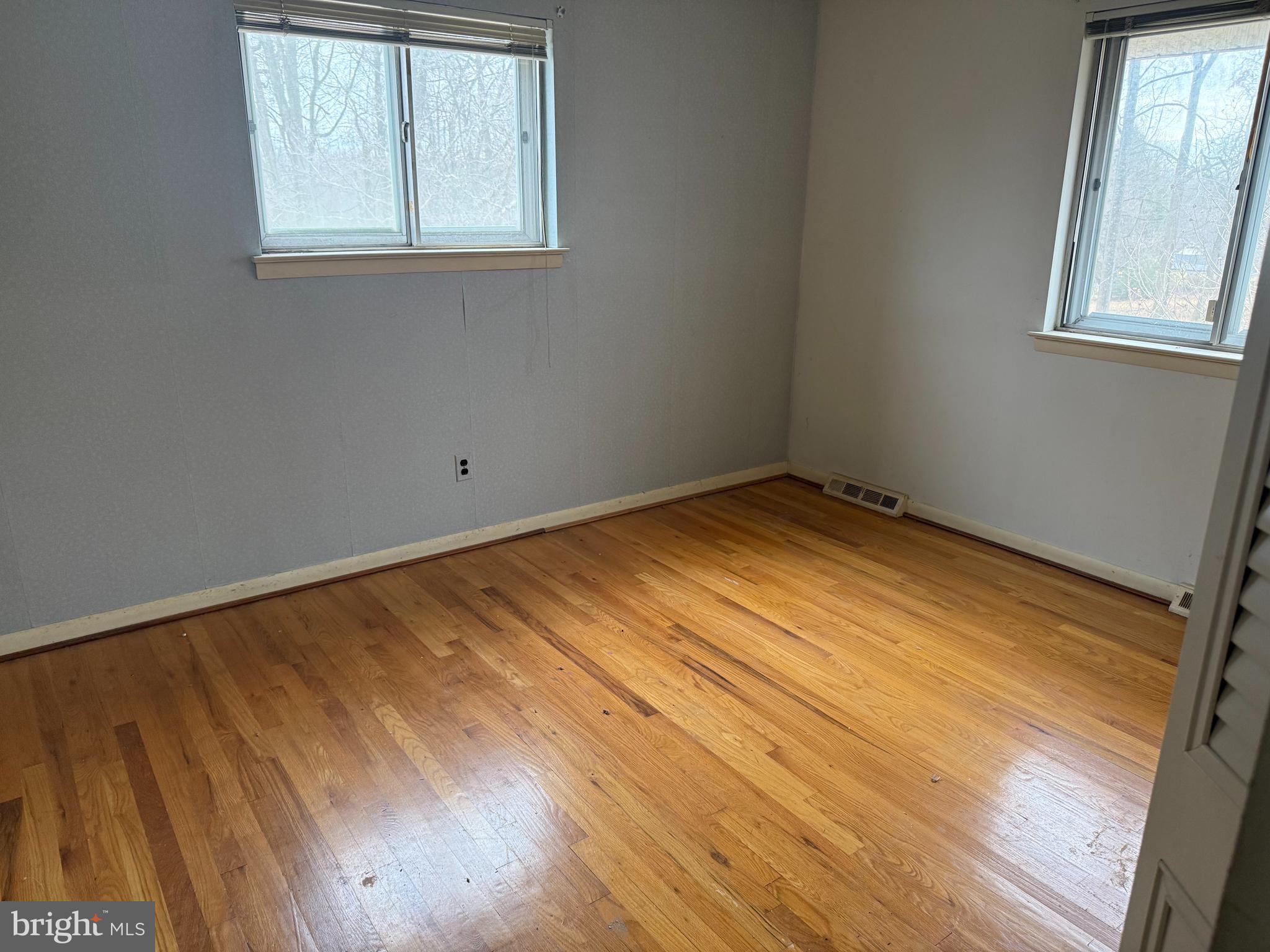 9822 Clanford Road Randallstown, MD 21133 - Photo 9 of 15 an empty room with windows