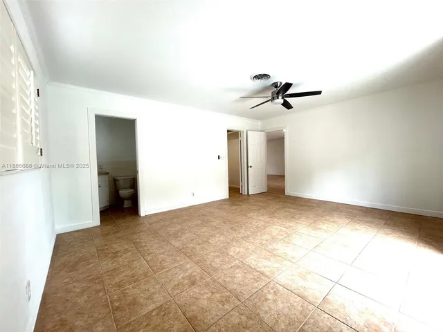 a white refrigerator freezer and a stove sitting inside of a kitchen