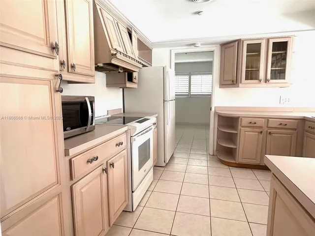 a view of a room that has a wooden bench