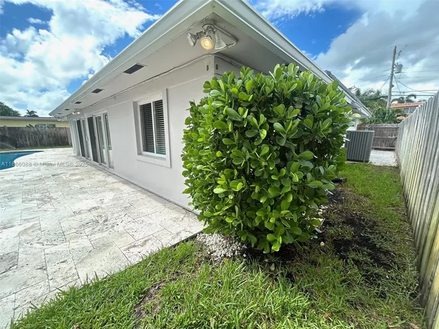 a view of swimming pool with a yard