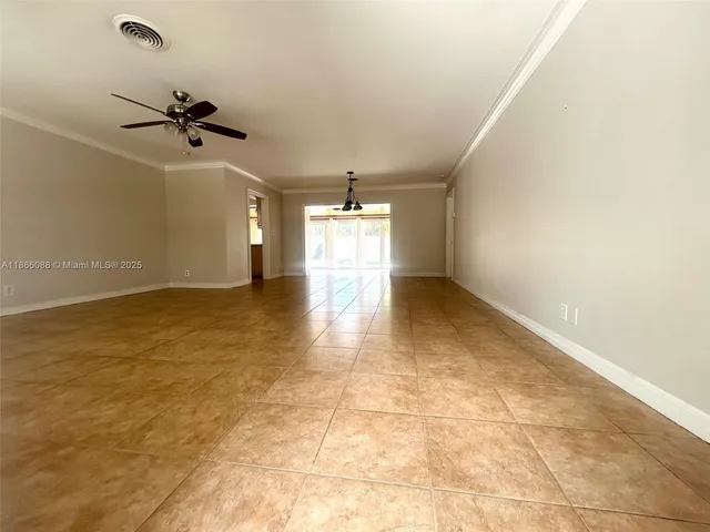 a view of an empty room and window