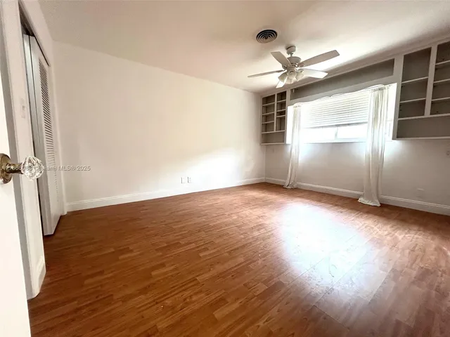 a bathroom with a double vanity sink and mirror
