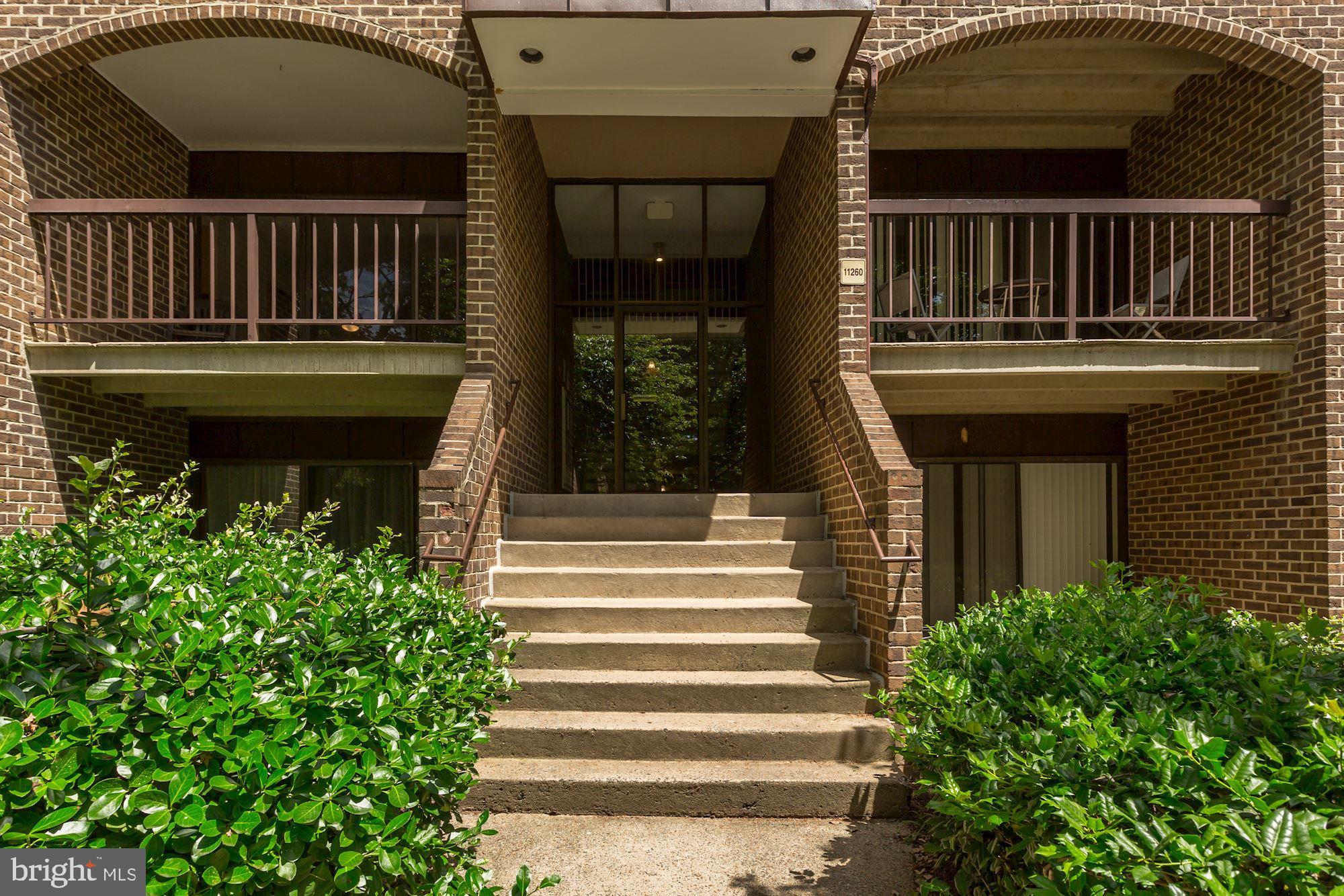 11260 Chestnut Grove Square, Unit 237 Reston, VA 20190 - Photo 2 of 37 The covered entryway greets your guests