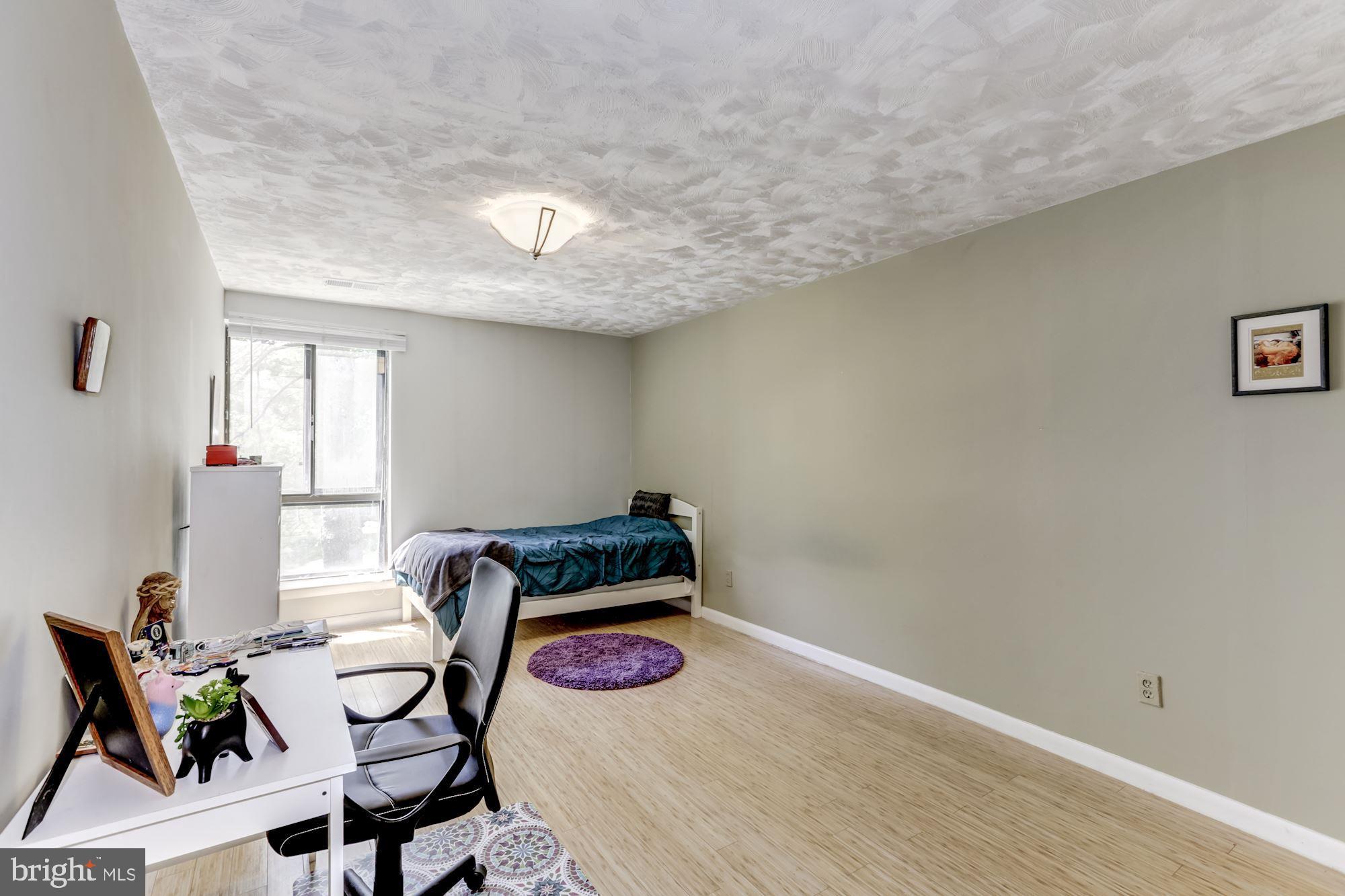 11260 Chestnut Grove Square, Unit 237 Reston, VA 20190 - Photo 28 of 37 Spacious 2nd bedroom offers laminate flooring