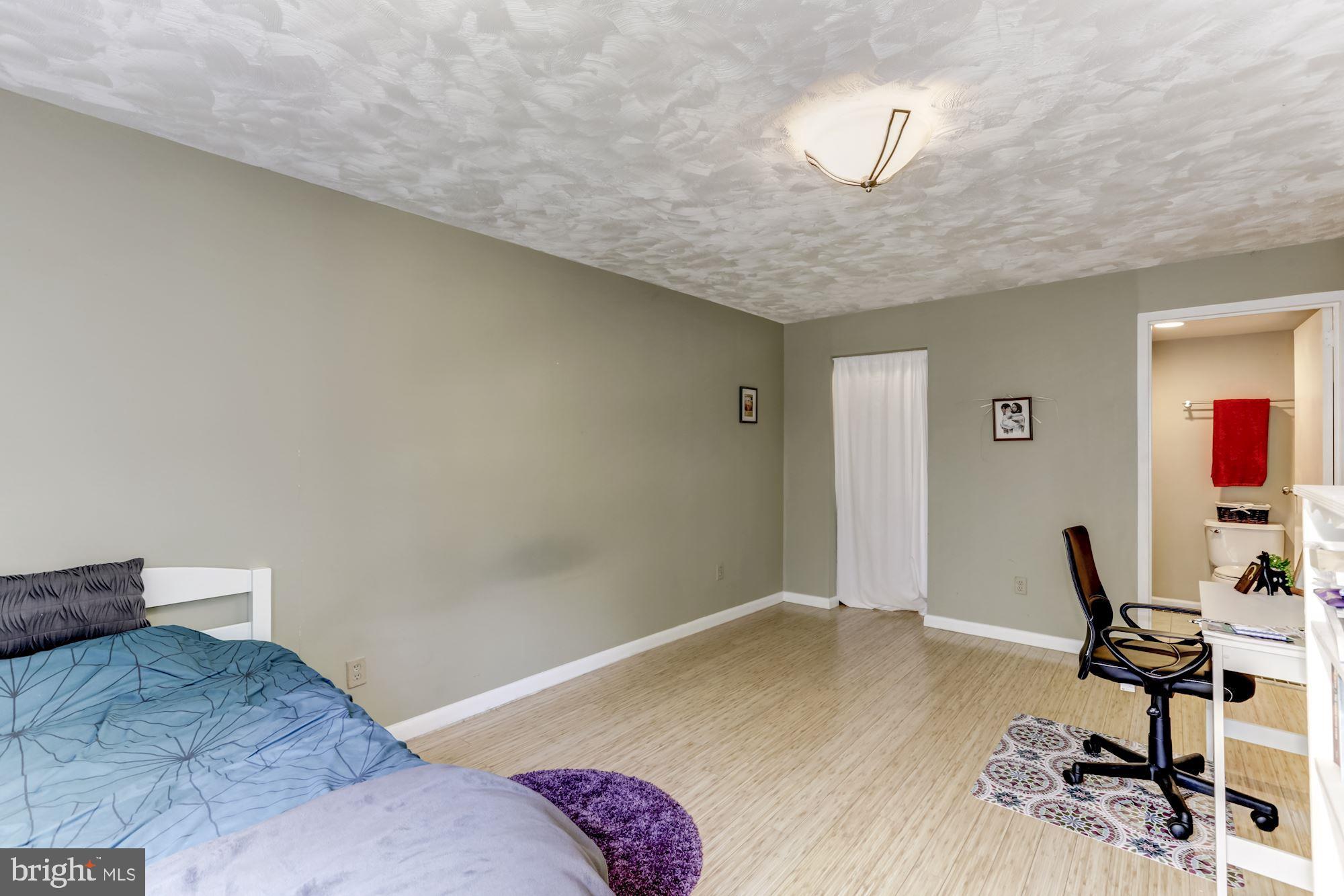 11260 Chestnut Grove Square, Unit 237 Reston, VA 20190 - Photo 29 of 37 2nd bedroom w/ walk-in closet & half bath