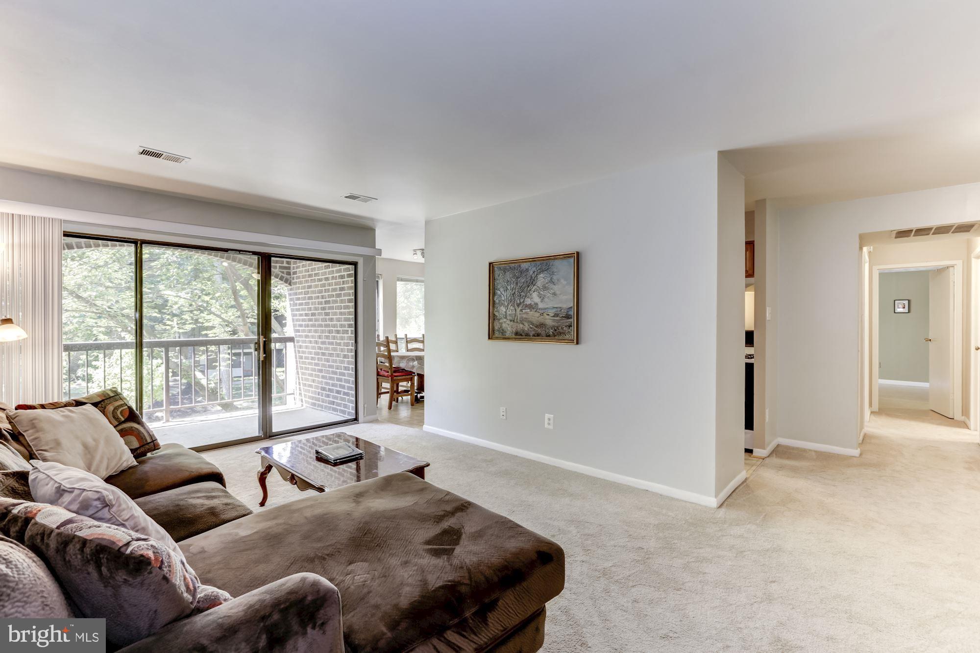 11260 Chestnut Grove Square, Unit 237 Reston, VA 20190 - Photo 6 of 37 Spacious living rm w/ oversized SGD to the balcony