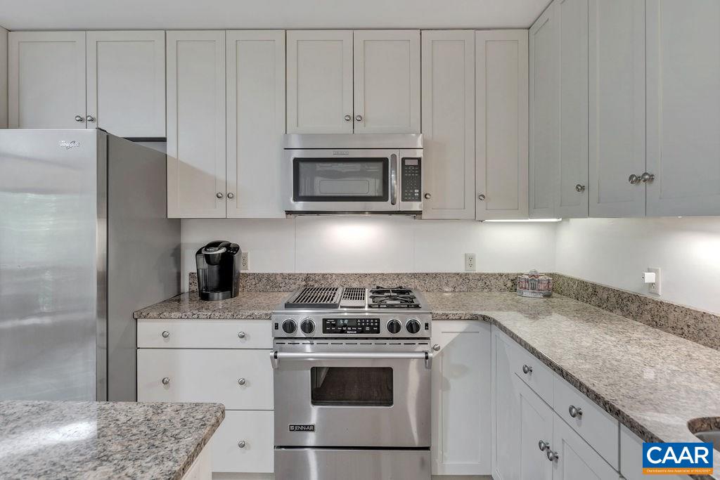 1903 Stillhouse Road Charlottesville, VA 22901 - Photo 13 of 44 a kitchen with granite countertop white cabinets and stainless steel appliances