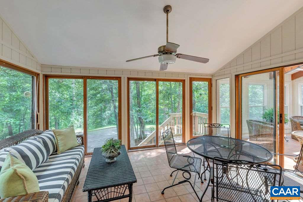 1903 Stillhouse Road Charlottesville, VA 22901 - Photo 15 of 44 a living room with furniture and floor to ceiling windows