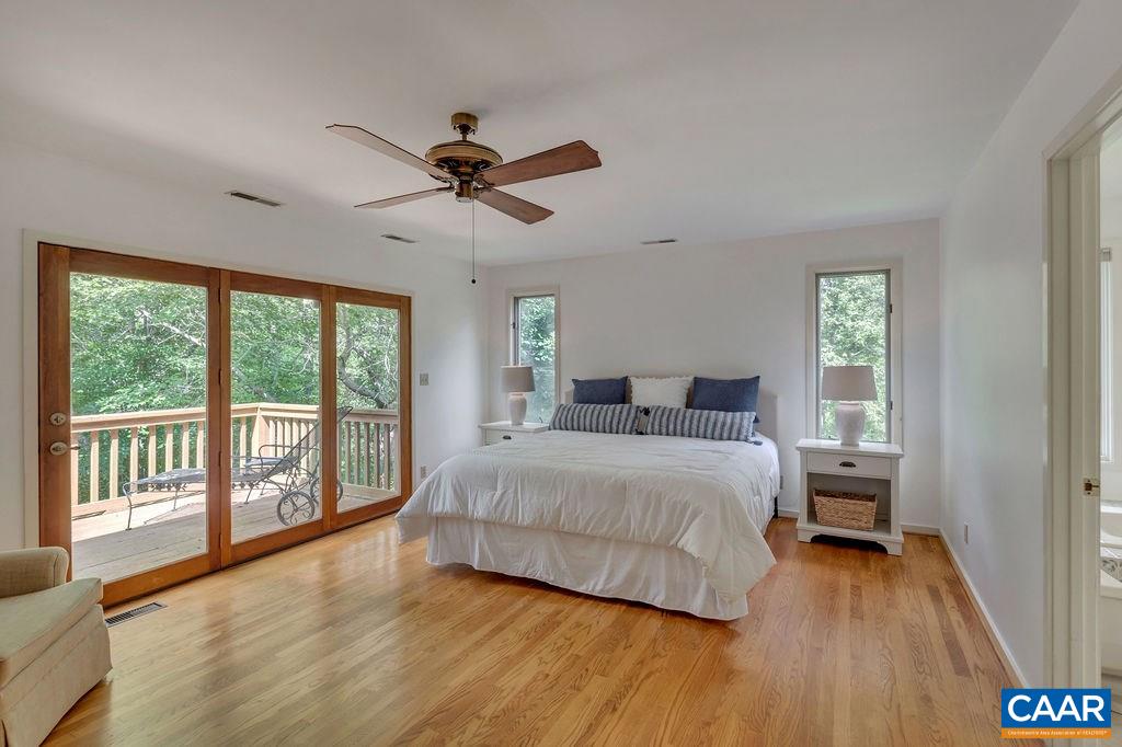 1903 Stillhouse Road Charlottesville, VA 22901 - Photo 19 of 44 a bedroom with a large bed and a large window