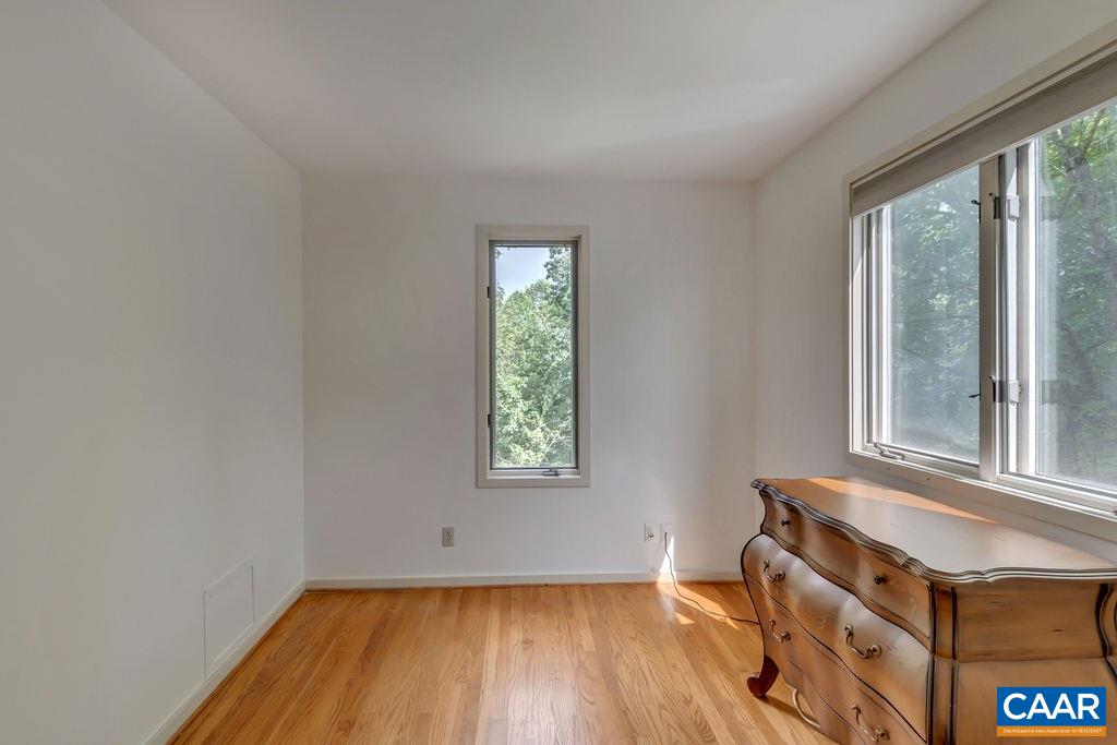 1903 Stillhouse Road Charlottesville, VA 22901 - Photo 23 of 44 an empty room with wooden floor and windows