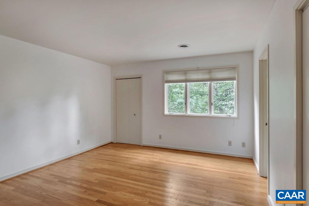1903 Stillhouse Road Charlottesville, VA 22901 - Photo 29 of 44 an empty room with wooden floor and windows