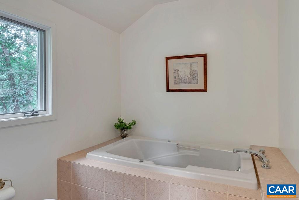 1903 Stillhouse Road Charlottesville, VA 22901 - Photo 32 of 44 a white bath tub sitting in a bathroom