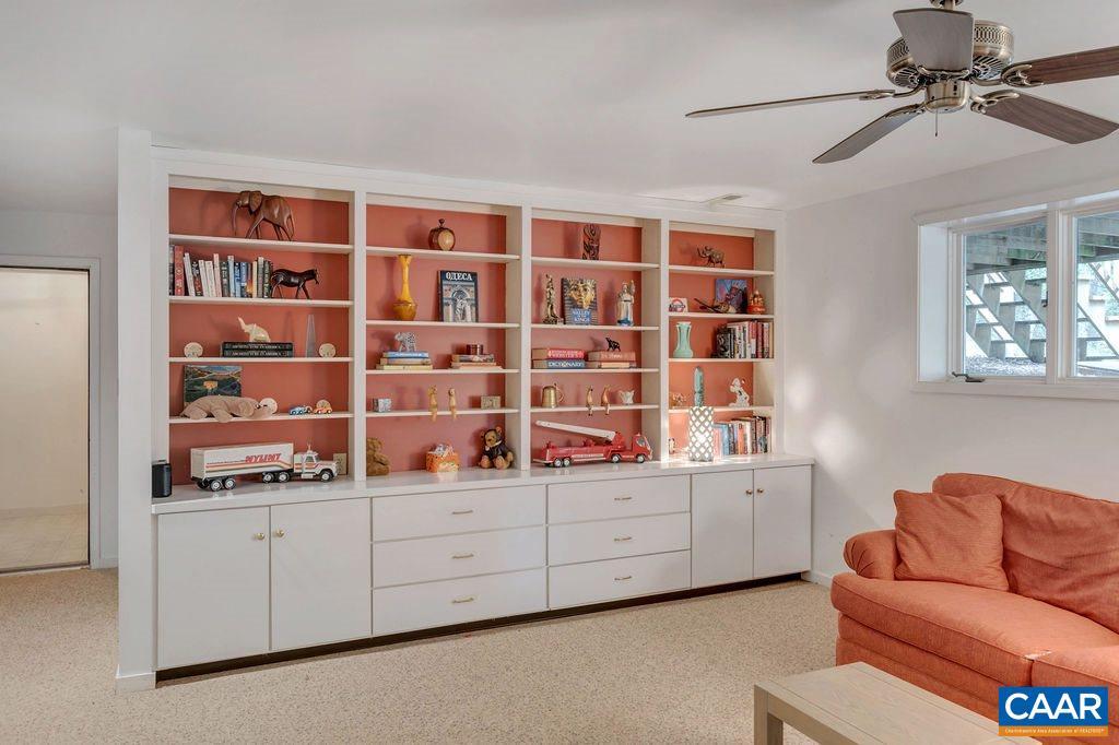 1903 Stillhouse Road Charlottesville, VA 22901 - Photo 34 of 44 a living room with a bookshelf and a book shelf