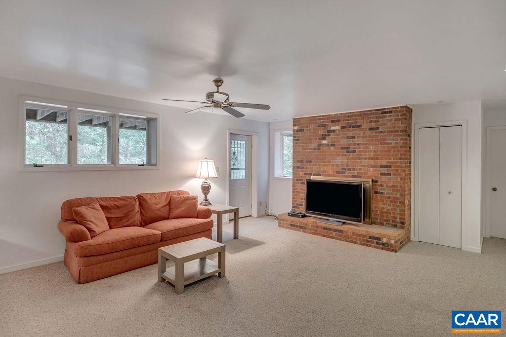 1903 Stillhouse Road Charlottesville, VA 22901 - Photo 35 of 44 a living room with furniture and a fireplace