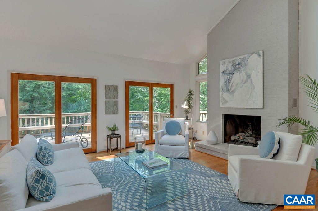 1903 Stillhouse Road Charlottesville, VA 22901 - Photo 6 of 44 a living room with furniture and a fireplace