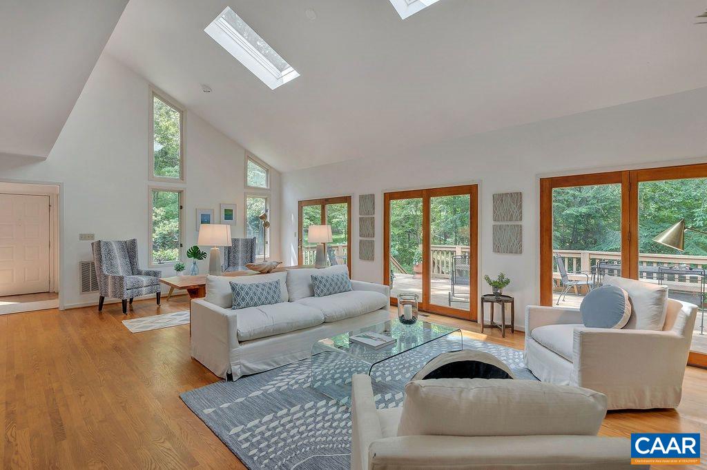1903 Stillhouse Road Charlottesville, VA 22901 - Photo 8 of 44 a living room with furniture and large windows