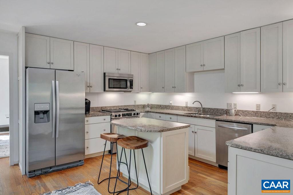 1903 Stillhouse Road Charlottesville, VA 22901 - Photo 10 of 44 a kitchen with granite countertop a refrigerator stove top oven and sink