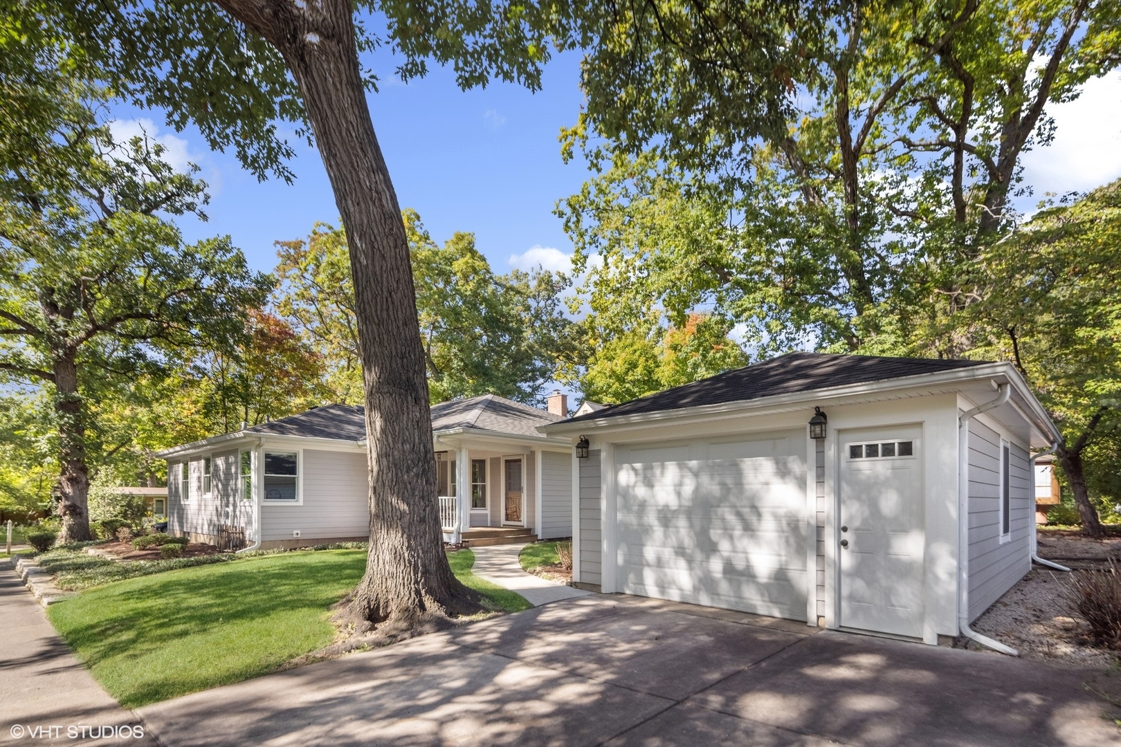 557 Riford Road Glen Ellyn, IL 60137 - Photo 22 of 25 a front view of a house with garden