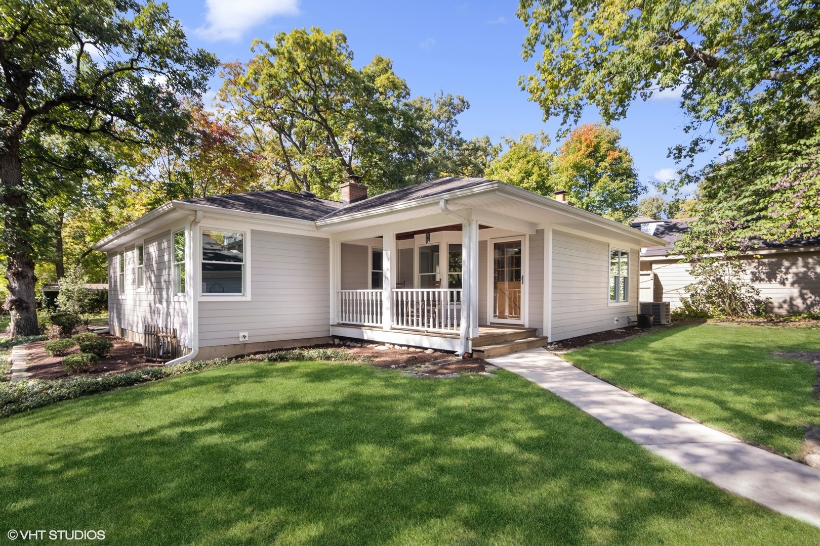 557 Riford Road Glen Ellyn, IL 60137 - Photo 3 of 25 a front view of a house with a garden