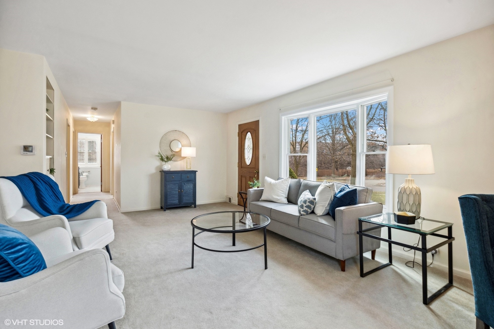557 Riford Road Glen Ellyn, IL 60137 - Photo 6 of 25 a living room with furniture and a large window