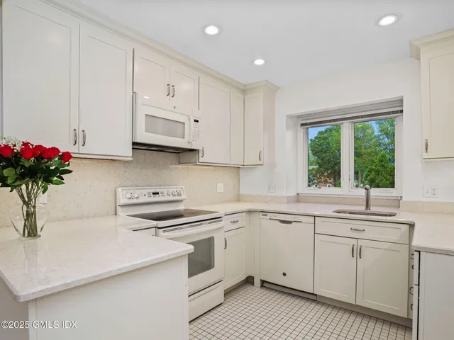 a bathroom with a sink a vanity and a mirror
