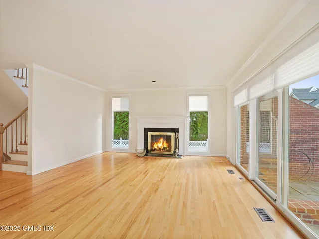 a view of a patio with table and chairs and potted plants