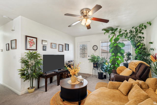 254 North 700 East Santaquin, UT 84655 - Photo 5 of 15 Carpeted living space featuring a ceiling fan with integrated lighting, a front entry door with decorative glass, and window blinds