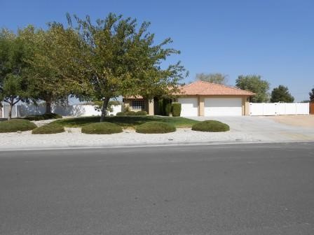 20334 Ochoa Road Apple Valley, CA 92307 - Photo 1 of 1 a front view of house with yard and green space