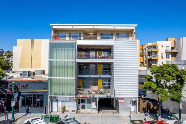 a front view of a building with glass windows