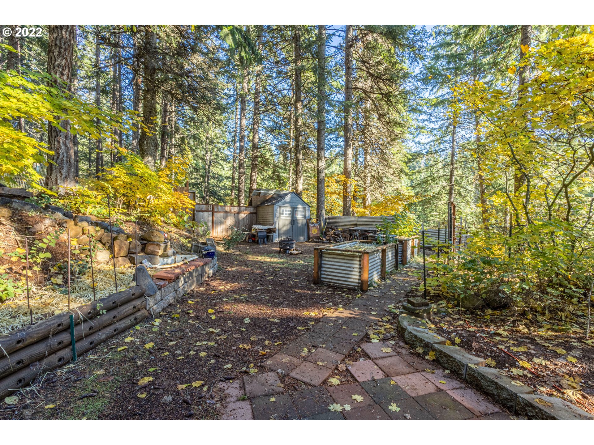 70 Moore Road White Salmon, WA 98672 - Photo 13 of 30 a backyard of a house with table and chairs