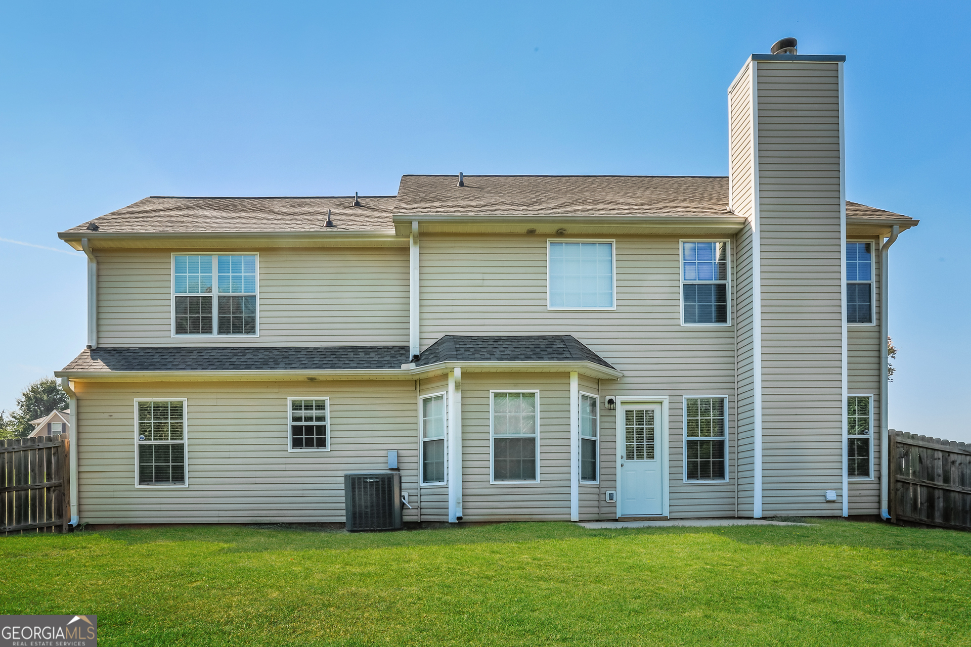 210 Heaton Pl Trail Covington, GA 30016 - Photo 15 of 17 a front view of a house with a garden