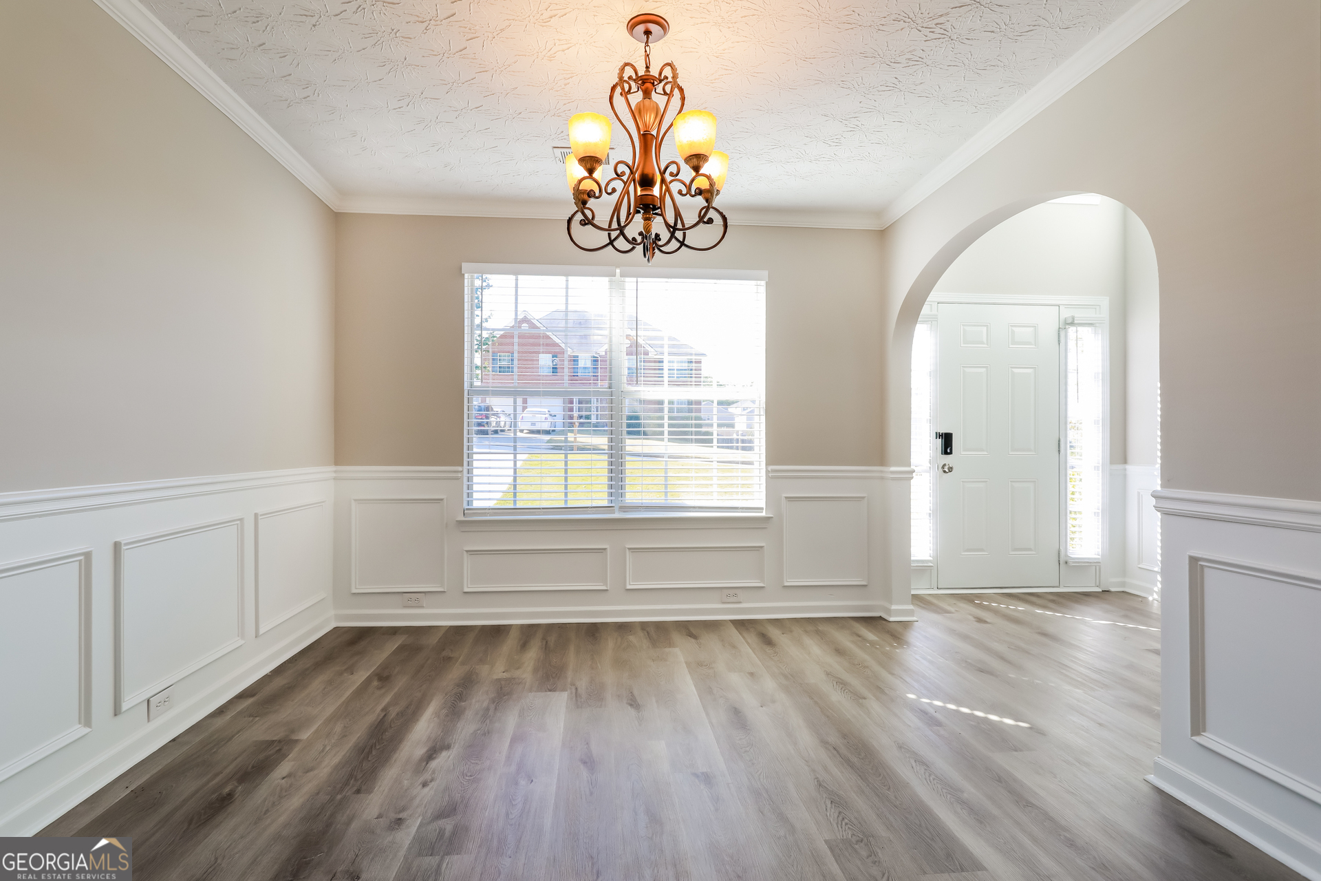 210 Heaton Pl Trail Covington, GA 30016 - Photo 4 of 17 wooden floor in an empty room with a window