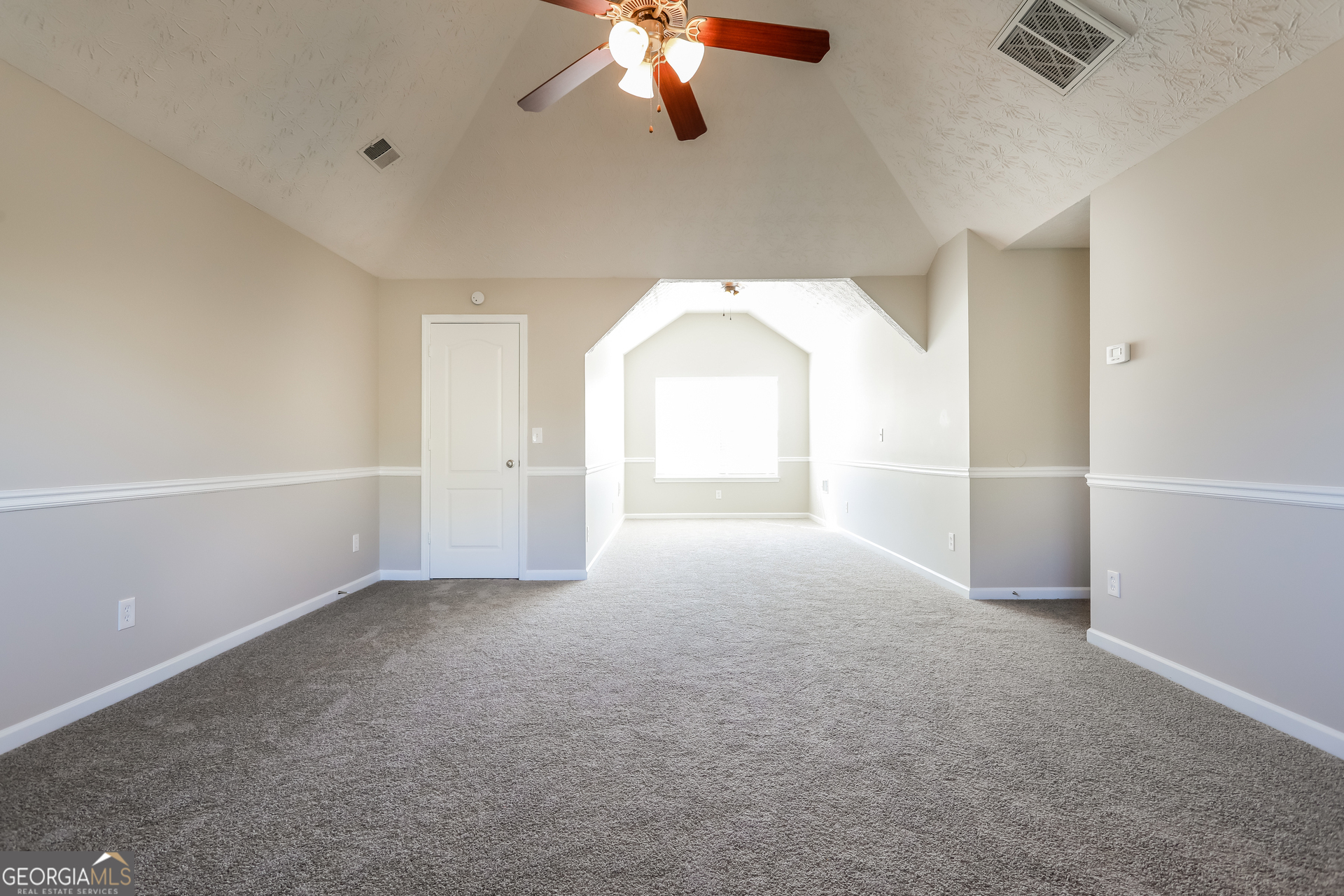 210 Heaton Pl Trail Covington, GA 30016 - Photo 6 of 17 wooden floor in an empty room with a window
