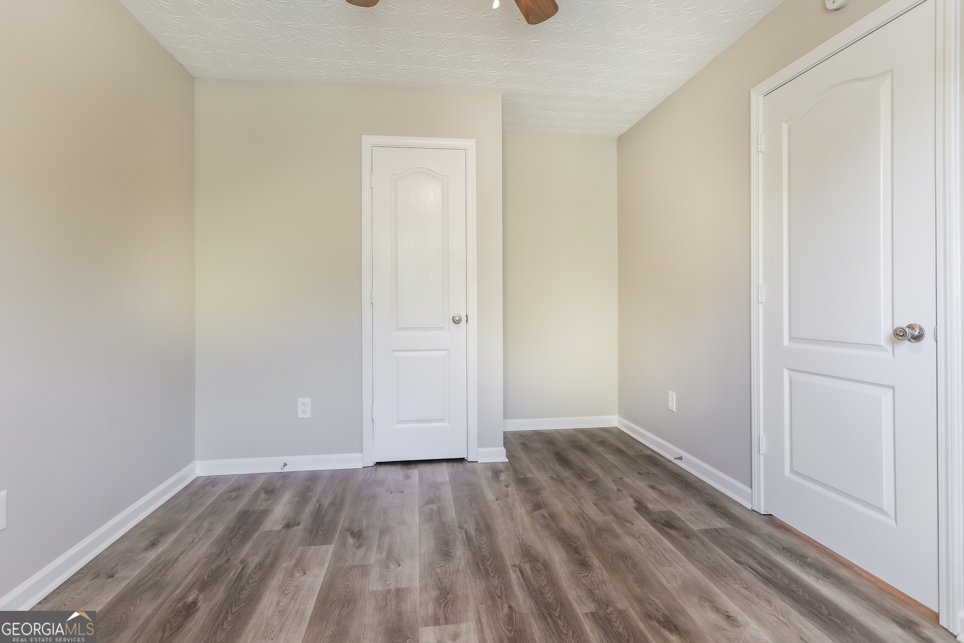 210 Heaton Pl Trail Covington, GA 30016 - Photo 9 of 17 a view of an empty room with closet and a window