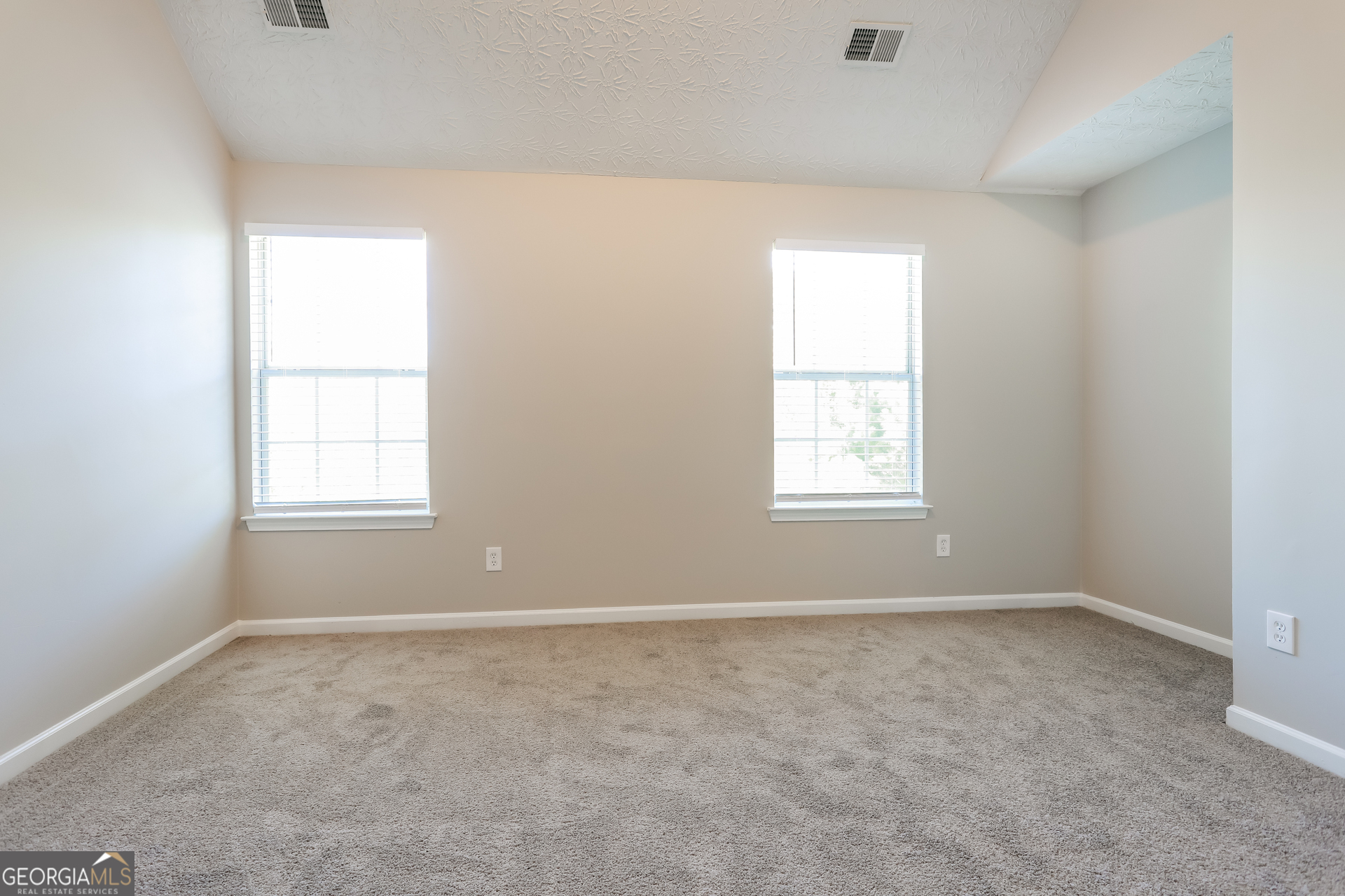 210 Heaton Pl Trail Covington, GA 30016 - Photo 10 of 17 an empty room with a window