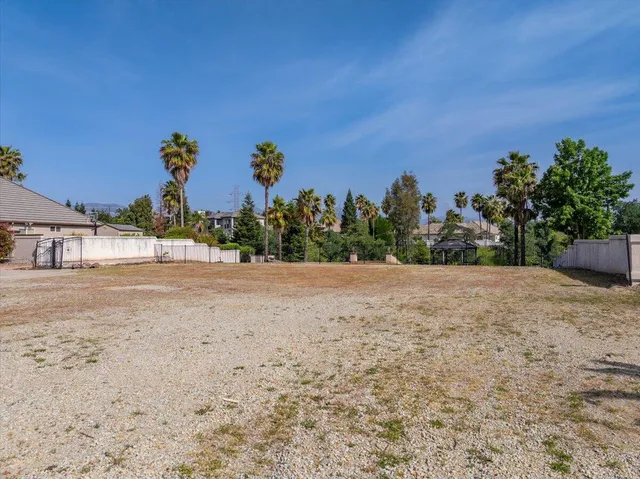 an aerial view of a yard with table and chairs