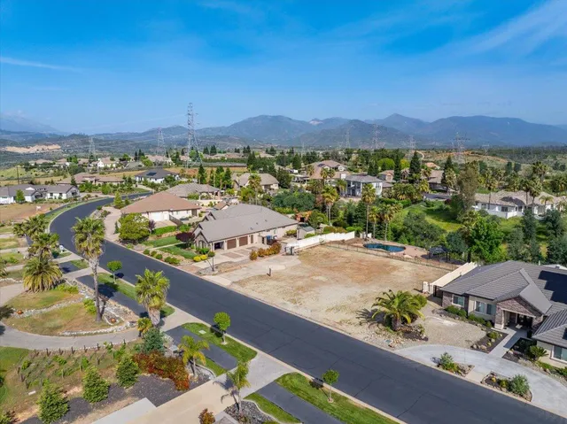 an aerial view of residential houses and outdoor space