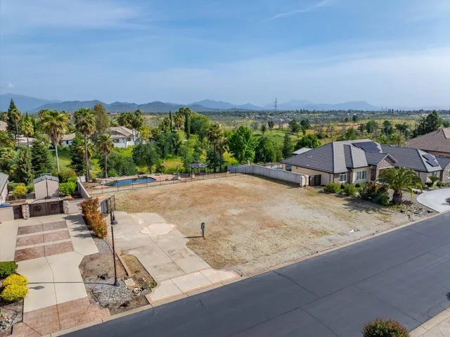 a view of a street with a building in the background