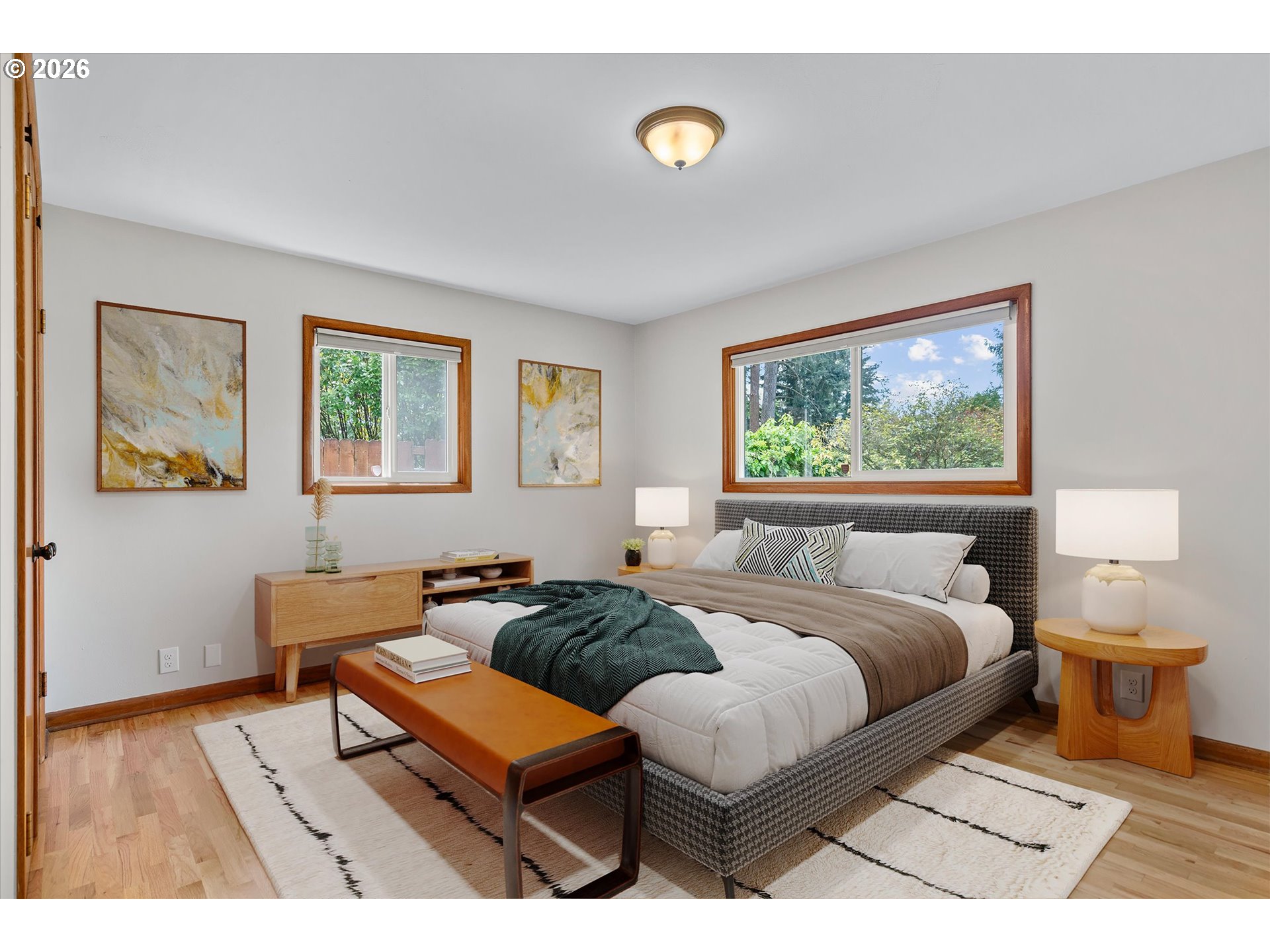 11345 Southwest 92nd Avenue Portland, OR 97223 - Photo 27 of 47 a bedroom with a bed and wooden floor