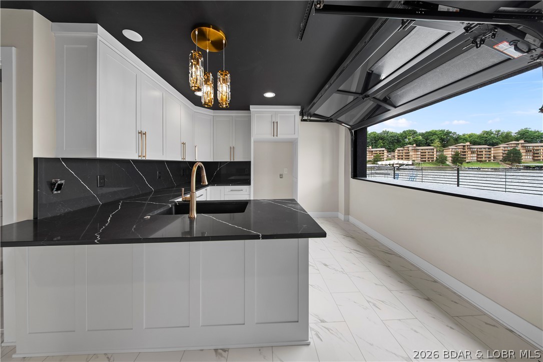 439 Red Bud Road Lake Ozark, MO 65049 - Photo 72 of 98 Full-service wet bar overlooking the lake with amp