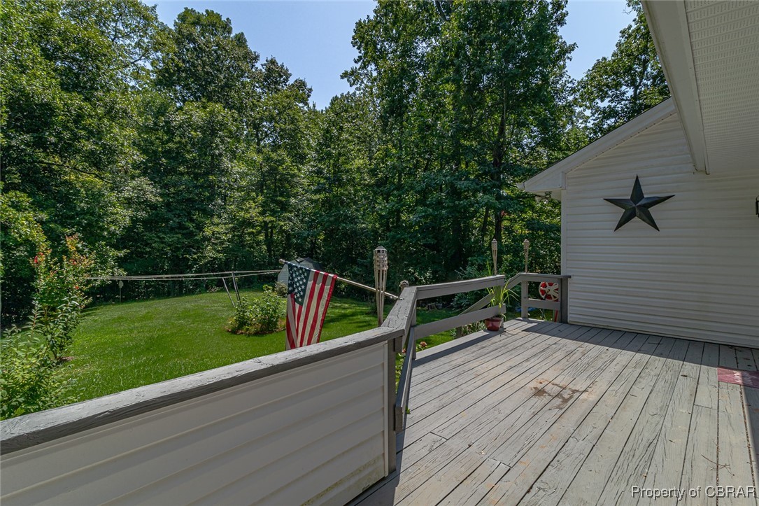 122 Old Glebe Point Road Burgess, VA 22432 - Photo 3 of 50 Wooden terrace with a lawn